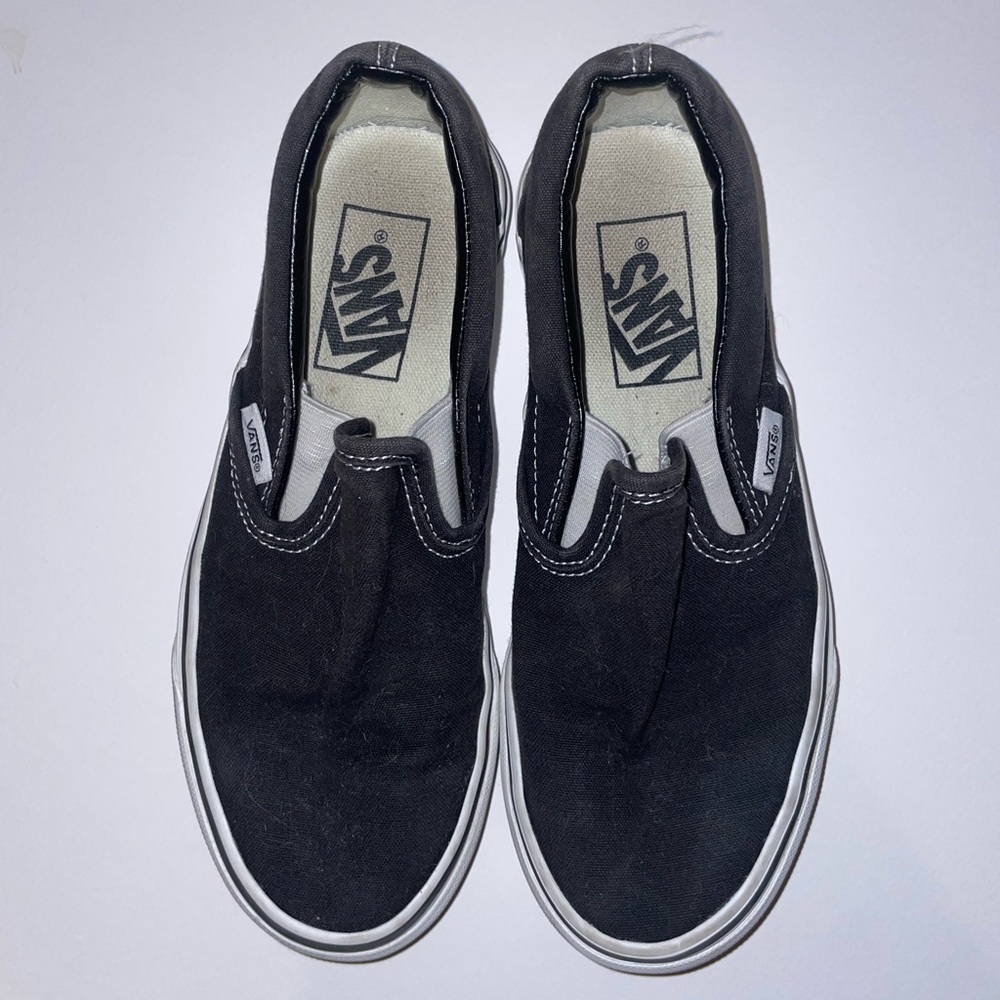 Women’s Black and White Canvas Slip On Vans
